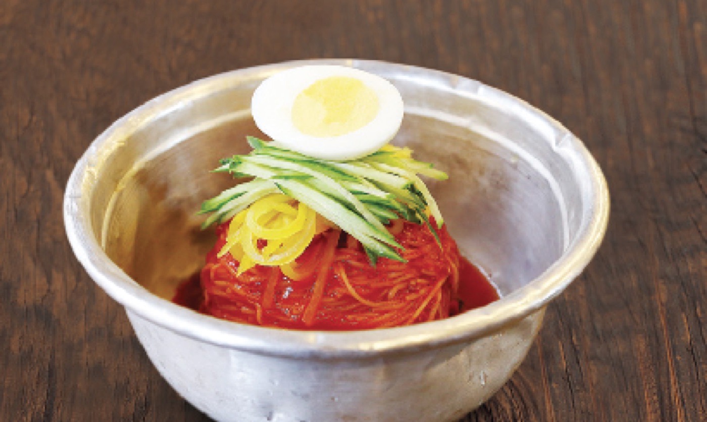 Spicy paste cold noodle topped with egg and cucumber