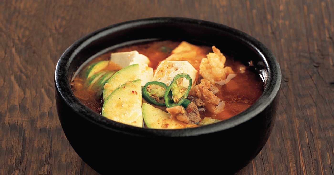 Beef brisket soybean paste stew in a black bowl