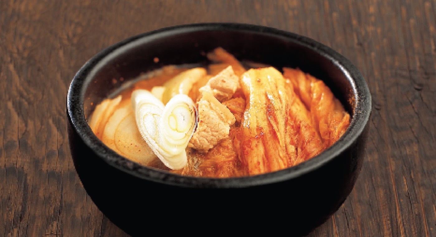 Pork kimchi stew in a stone bowl
